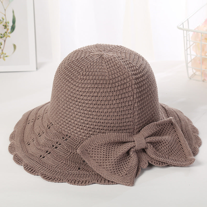 Foldable knitted straw hat with bow