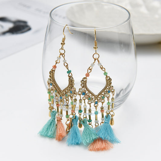 Bohemian hollow dripping oil rice beads fan-shaped tassel long earrings